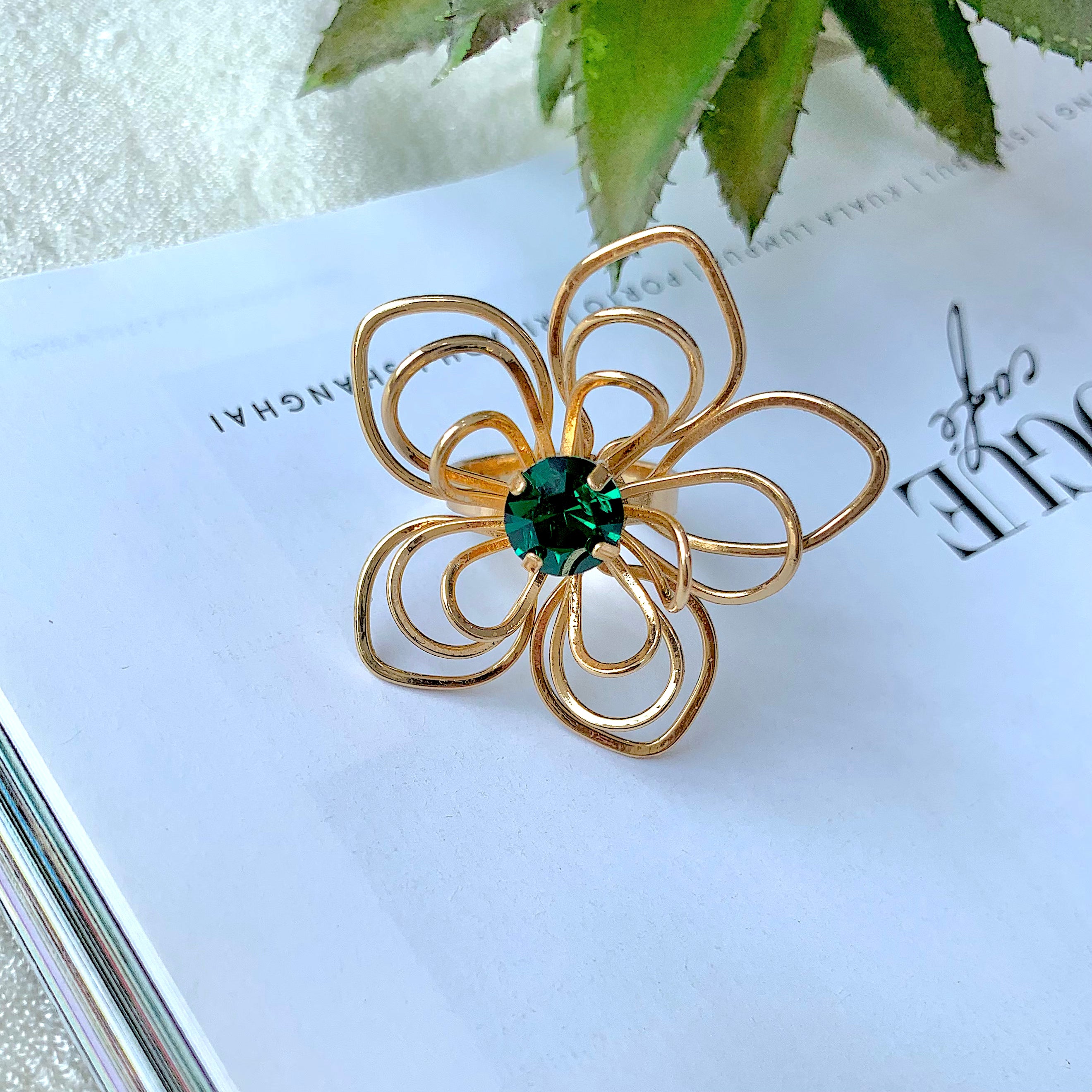 TFC Floral Emerald Statement Gold Plated Adjustable Ring-Elevate your style with our exquisite collection of gold-plated adjustable rings for women, including timeless signet rings. Explore cheapest fashion jewellery designs with anti-tarnish properties, all at The Fun Company with a touch of elegance