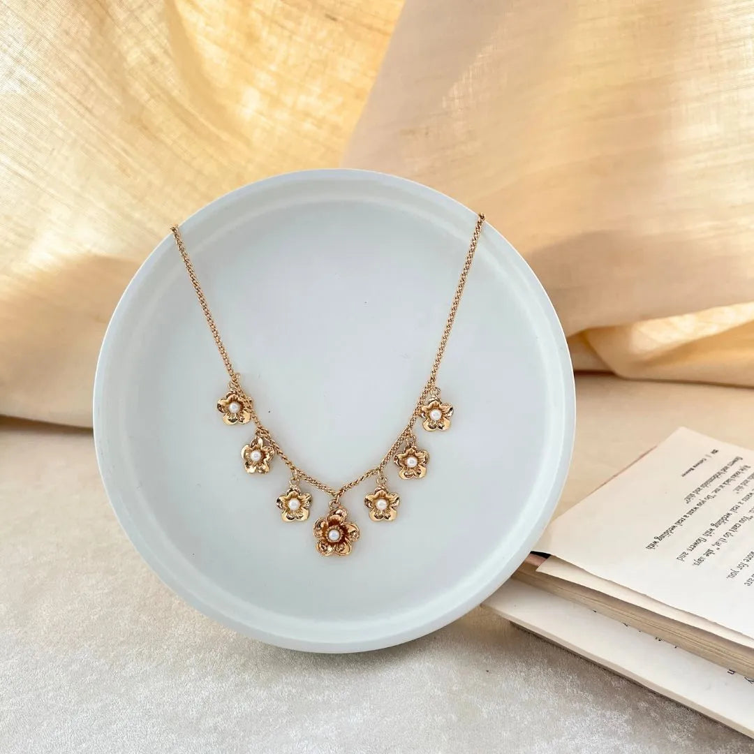 TFC Flower Pearls Charms Gold Plated Necklace-Enhance your elegance with our collection of gold-plated necklaces for women. Choose from stunning pendant necklaces, chic choker necklaces, and trendy layered necklaces. Our sleek and dainty designs are both affordable and anti-tarnish, ensuring lasting beauty. Enjoy the cheapest fashion jewellery, lightweight and stylish- only at The Fun Company.