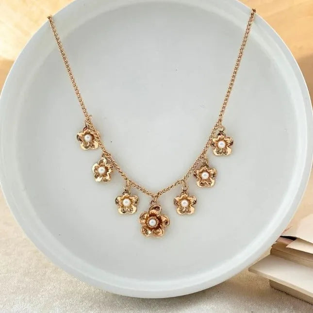 TFC Flower Pearls Charms Gold Plated Necklace-Enhance your elegance with our collection of gold-plated necklaces for women. Choose from stunning pendant necklaces, chic choker necklaces, and trendy layered necklaces. Our sleek and dainty designs are both affordable and anti-tarnish, ensuring lasting beauty. Enjoy the cheapest fashion jewellery, lightweight and stylish- only at The Fun Company.