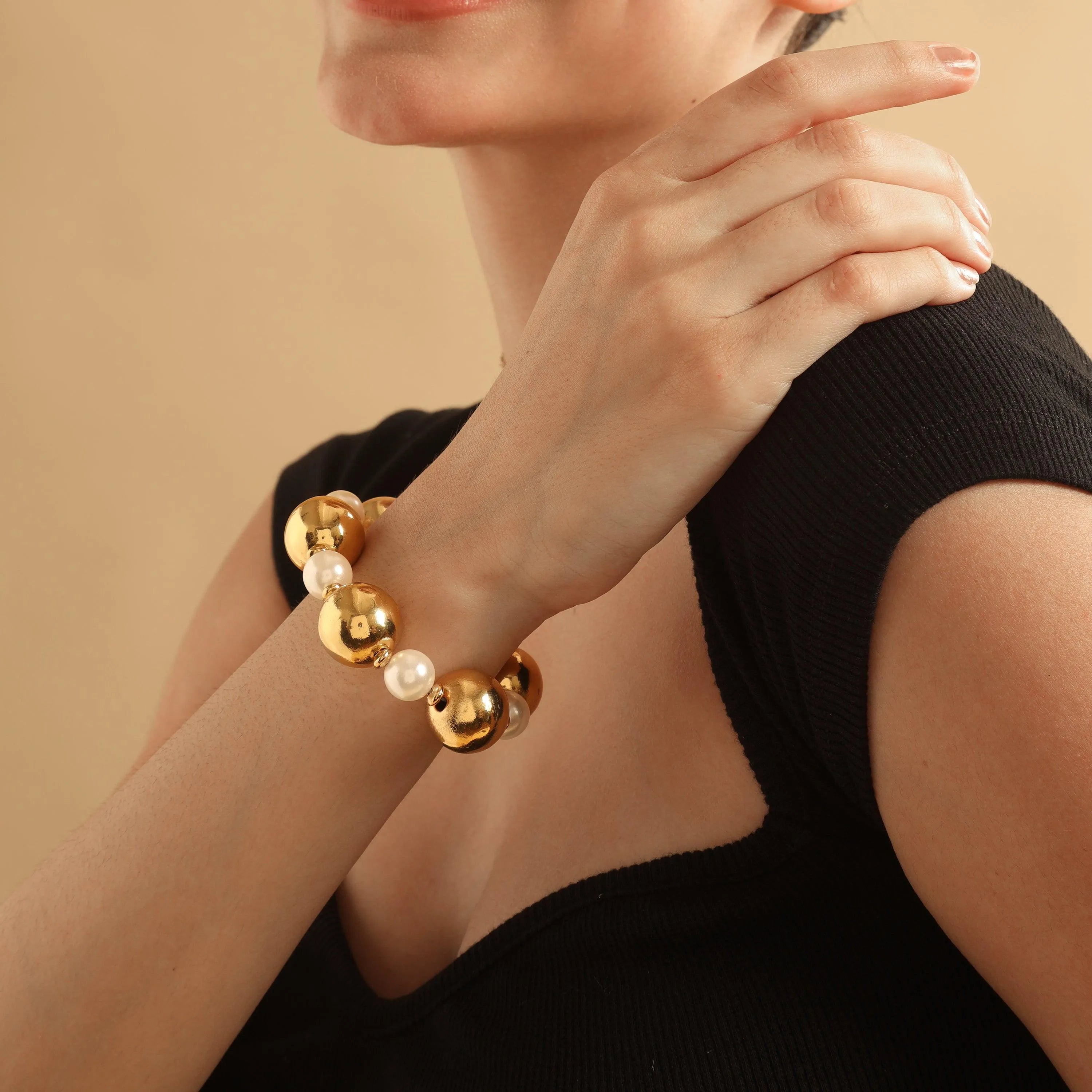 TFC Bold And Gold Pearl Bead Bracelet-Discover our stunning collection of stylish bracelets for women, featuring exquisite pearl bracelets, handcrafted beaded bracelets, and elegant gold-plated designs. Enjoy cheapest anti-tarnish fashion jewellery and long-lasting brilliance onl
