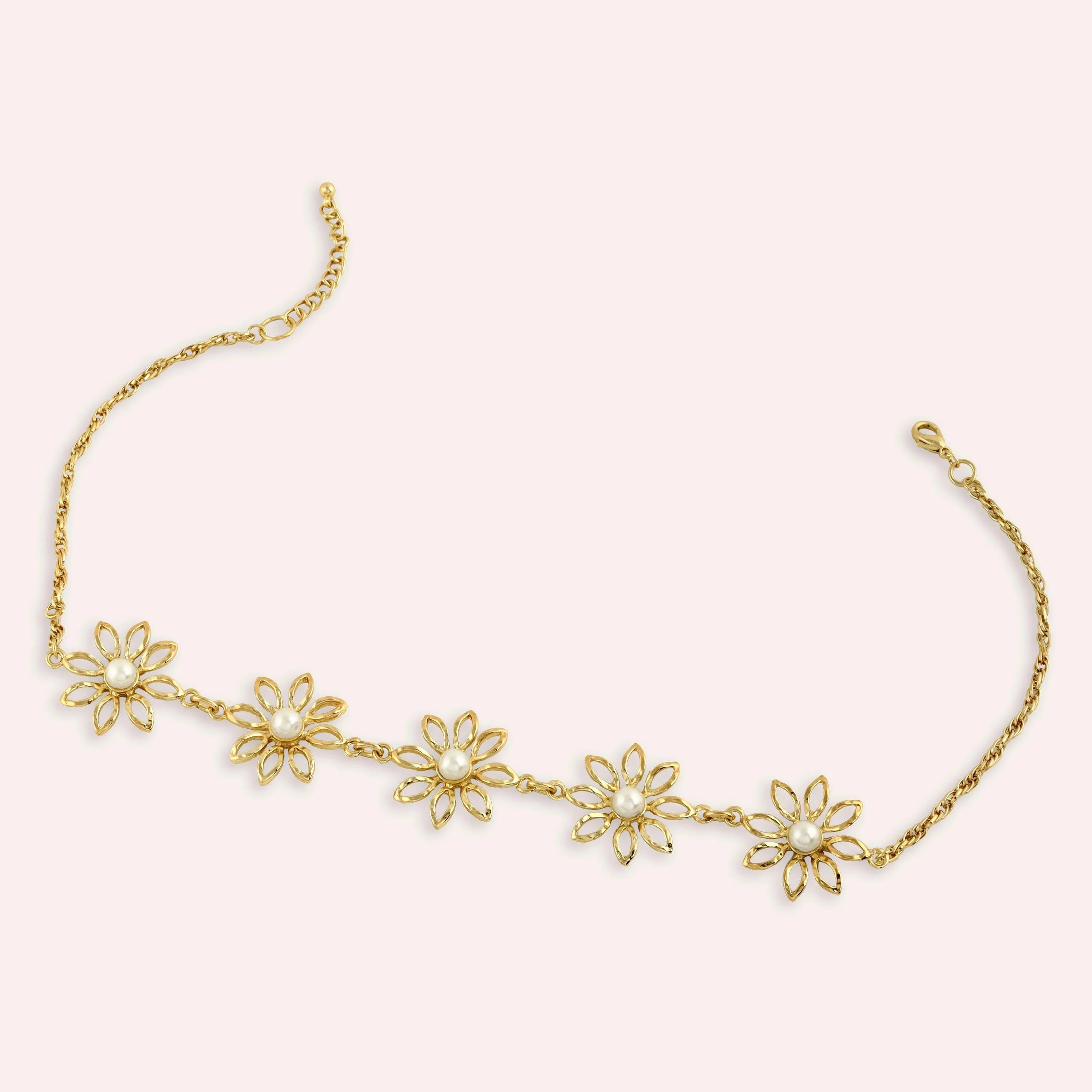 TFC Daisy Gold Plated Pearl Necklace-Enhance your elegance with our collection of gold-plated necklaces for women. Choose from stunning pendant necklaces, chic choker necklaces, and trendy layered necklaces. Our sleek and dainty designs are both affordable and anti-tarnish, ensuring lasting beauty. Enjoy the cheapest fashion jewellery, lightweight and stylish- only at The Fun Company