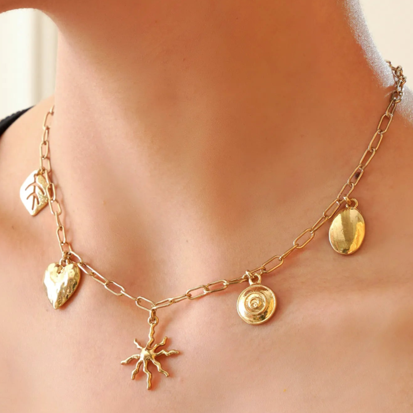 TFC Dreamy Charms Gold Plated Necklace-Enhance your elegance with our collection of gold-plated necklaces for women. Choose from stunning pendant necklaces, chic choker necklaces, and trendy layered necklaces. Our sleek and dainty designs are both affordable and anti-tarnish, ensuring lasting beauty. Enjoy the cheapest fashion jewellery, lightweight and stylish- only at The Fun Company.
