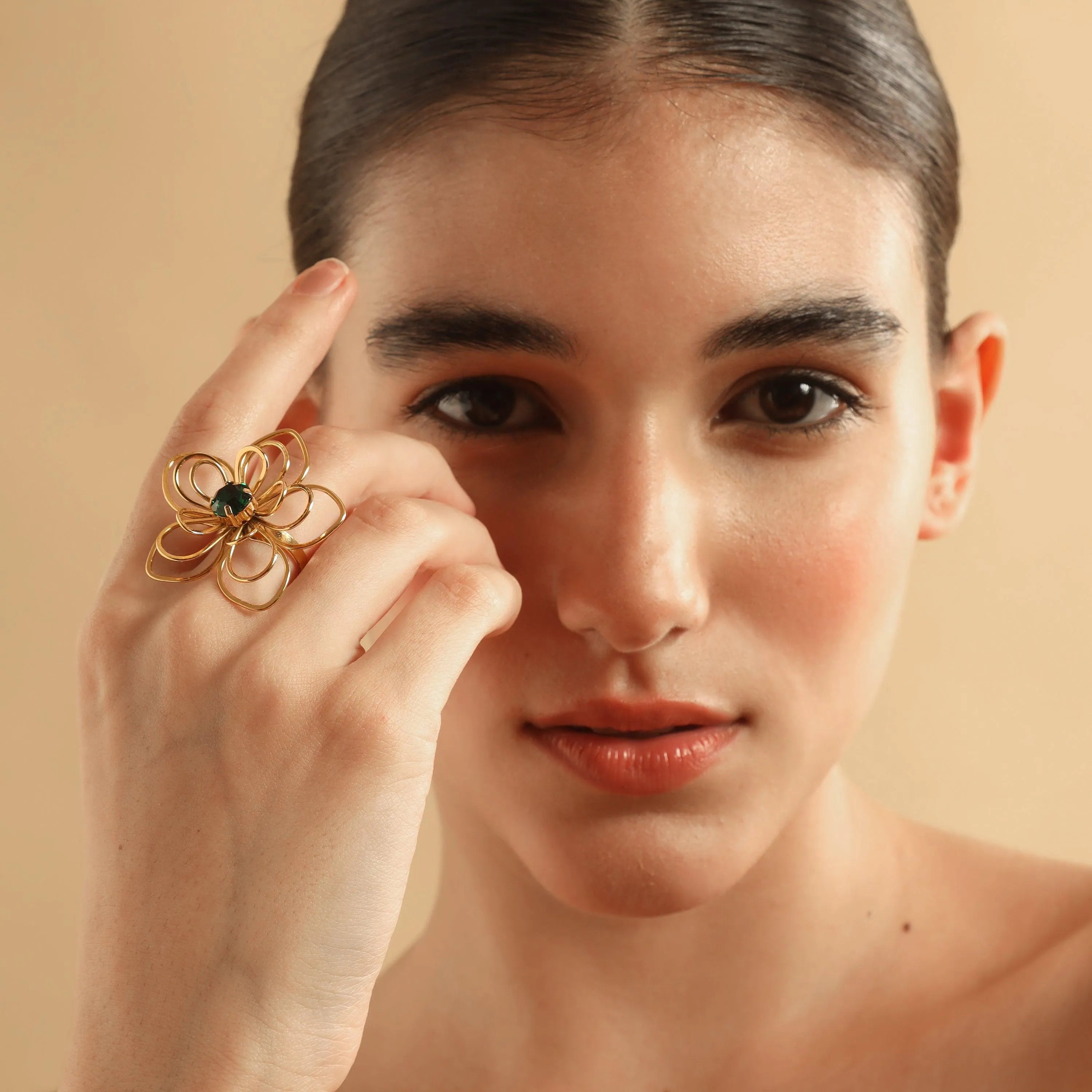 TFC Floral Emerald Statement Gold Plated Adjustable Ring-Elevate your style with our exquisite collection of gold-plated adjustable rings for women, including timeless signet rings. Explore cheapest fashion jewellery designs with anti-tarnish properties, all at The Fun Company with a touch of elegance