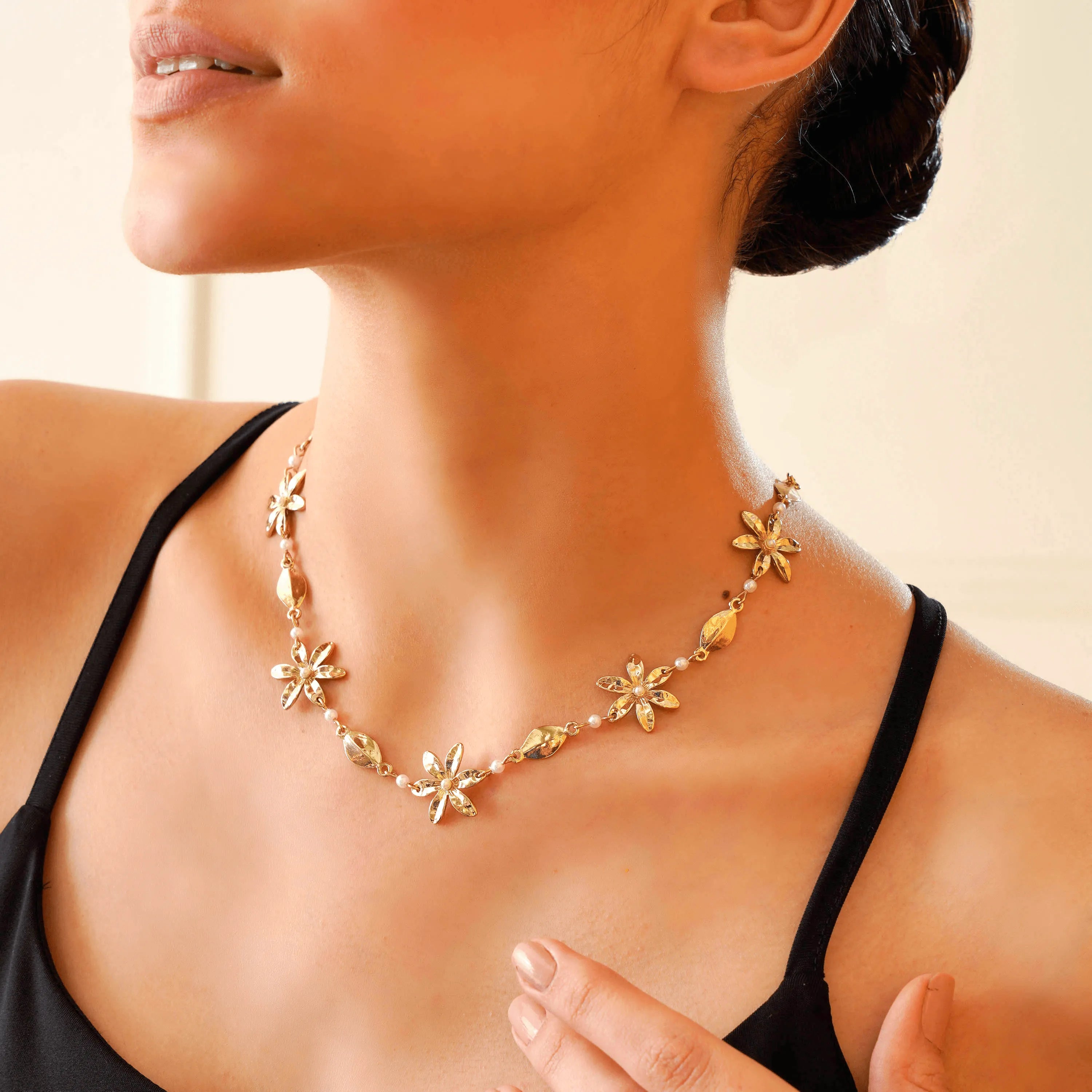 TFC Floral Gold Plated Pearl Necklace-Enhance your elegance with our collection of gold-plated necklaces for women. Choose from stunning pendant necklaces, chic choker necklaces, and trendy layered necklaces. Our sleek and dainty designs are both affordable and anti-tarnish, ensuring lasting beauty. Enjoy the cheapest fashion jewellery, lightweight and stylish- only at The Fun Company