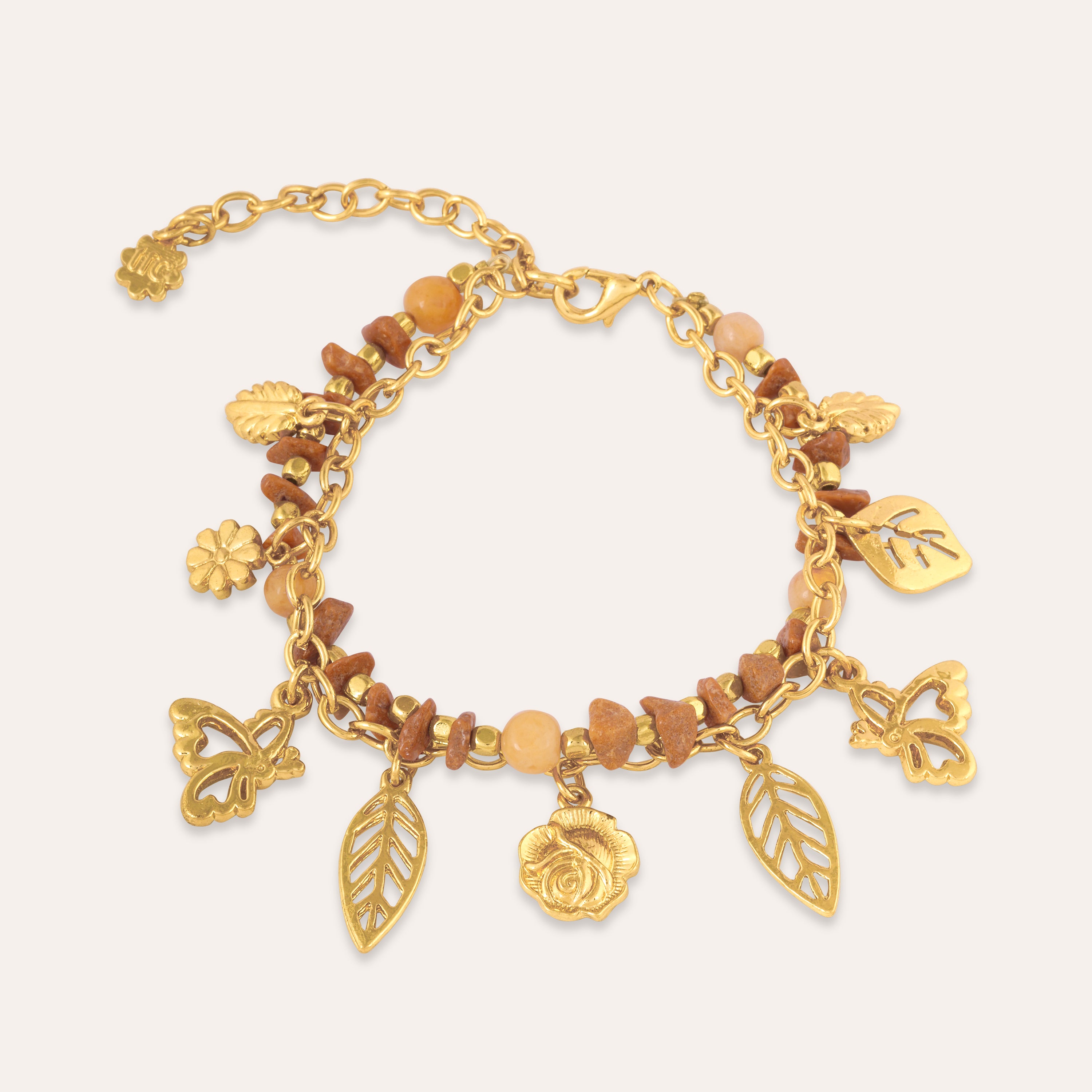 TFC Stones and Charms Gold Plated Bracelet Stack-Discover our stunning collection of stylish bracelets for women, featuring exquisite pearl bracelets, handcrafted beaded bracelets, and elegant gold-plated designs. Enjoy cheapest anti-tarnish fashion jewellery and long-lasting brilliance only at The Fun Company.