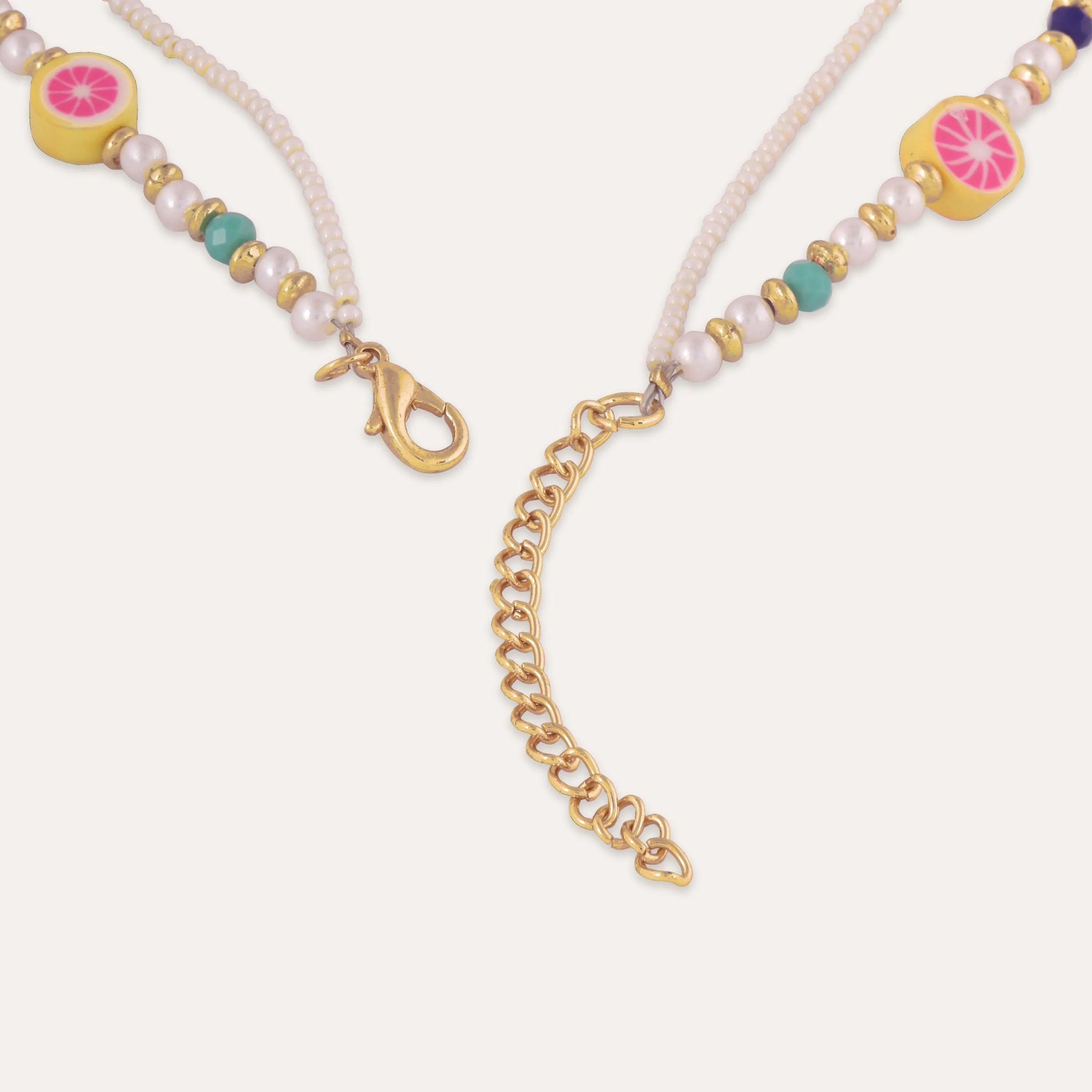 TFC Y2K FruitAura Pearls Layered Necklace -Enhance your elegance with our collection of gold-plated necklaces for women. Choose from stunning pendant necklaces, chic choker necklaces, and trendy layered necklaces. Our sleek and dainty designs are both affordable and anti-tarnish, ensuring lasting beauty. Enjoy the cheapest fashion jewellery, lightweight and stylish- only at The Fun Company.