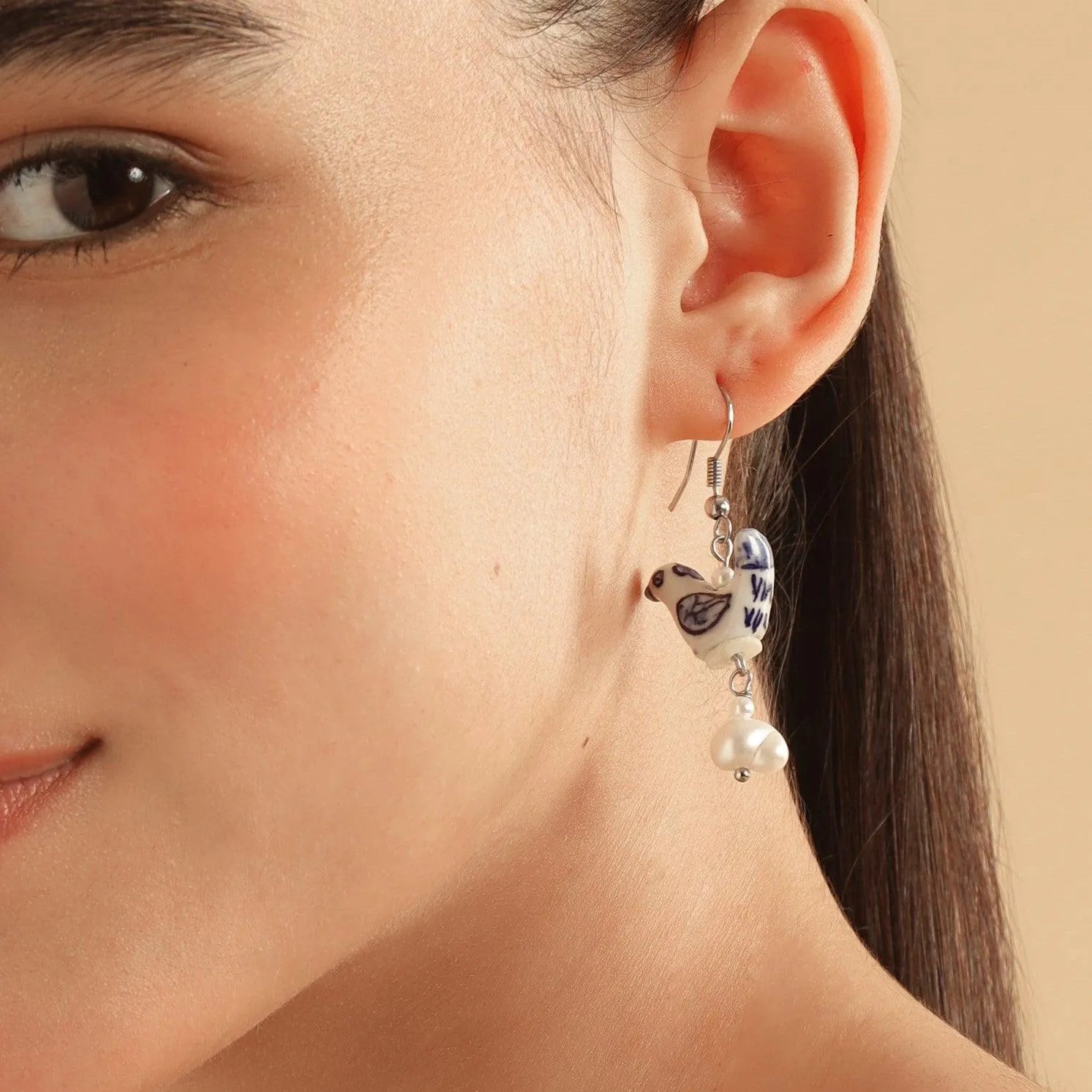 TFC Blue Bird and Pearl Dangler Earring- Discover daily wear gold earrings including stud earrings, hoop earrings, and pearl earrings, perfect as earrings for women and earrings for girls.Find the cheapest fashion jewellery which is anti-tarnis​h only at The Fun company