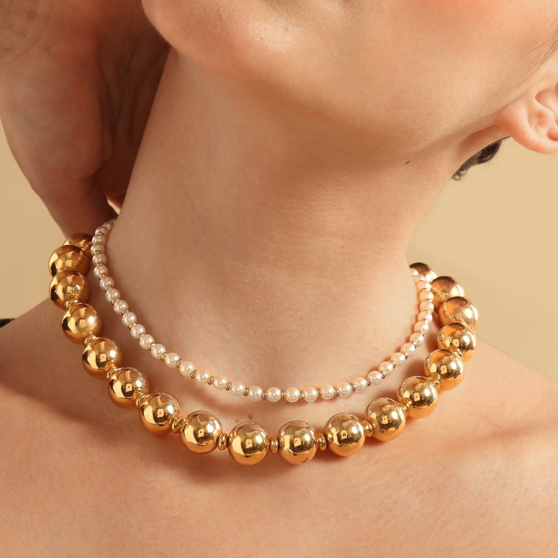 TFC Gold Beads and Pearl Layer Necklace-Enhance your elegance with our collection of gold-plated necklaces for women. Choose from stunning pendant necklaces, chic choker necklaces, and trendy layered necklaces. Our sleek and dainty designs are both affordable and anti-tarnish, ensuring lasting beauty. Enjoy the cheapest fashion jewellery, lightweight and stylish- only at The Fun Company.