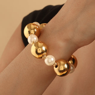 TFC Bold And Gold Pearl Bead Bracelet-Discover our stunning collection of stylish bracelets for women, featuring exquisite pearl bracelets, handcrafted beaded bracelets, and elegant gold-plated designs. Enjoy cheapest anti-tarnish fashion jewellery and long-lasting brilliance onl