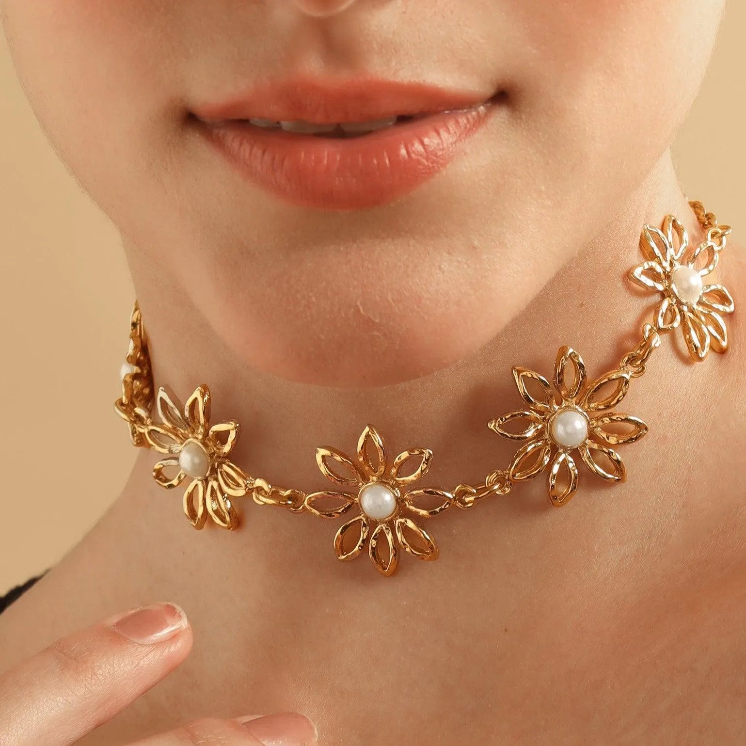 TFC Daisy Gold Plated Pearl Necklace-Enhance your elegance with our collection of gold-plated necklaces for women. Choose from stunning pendant necklaces, chic choker necklaces, and trendy layered necklaces. Our sleek and dainty designs are both affordable and anti-tarnish, ensuring lasting beauty. Enjoy the cheapest fashion jewellery, lightweight and stylish- only at The Fun Company