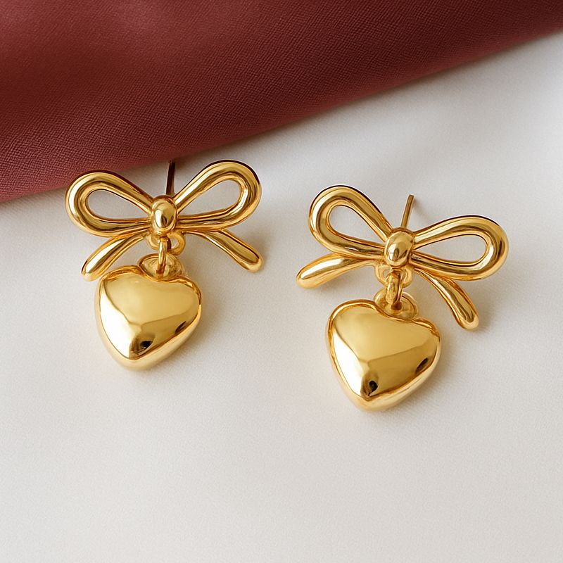 TFC Bow Heart Gold Plated Dangler Earrings